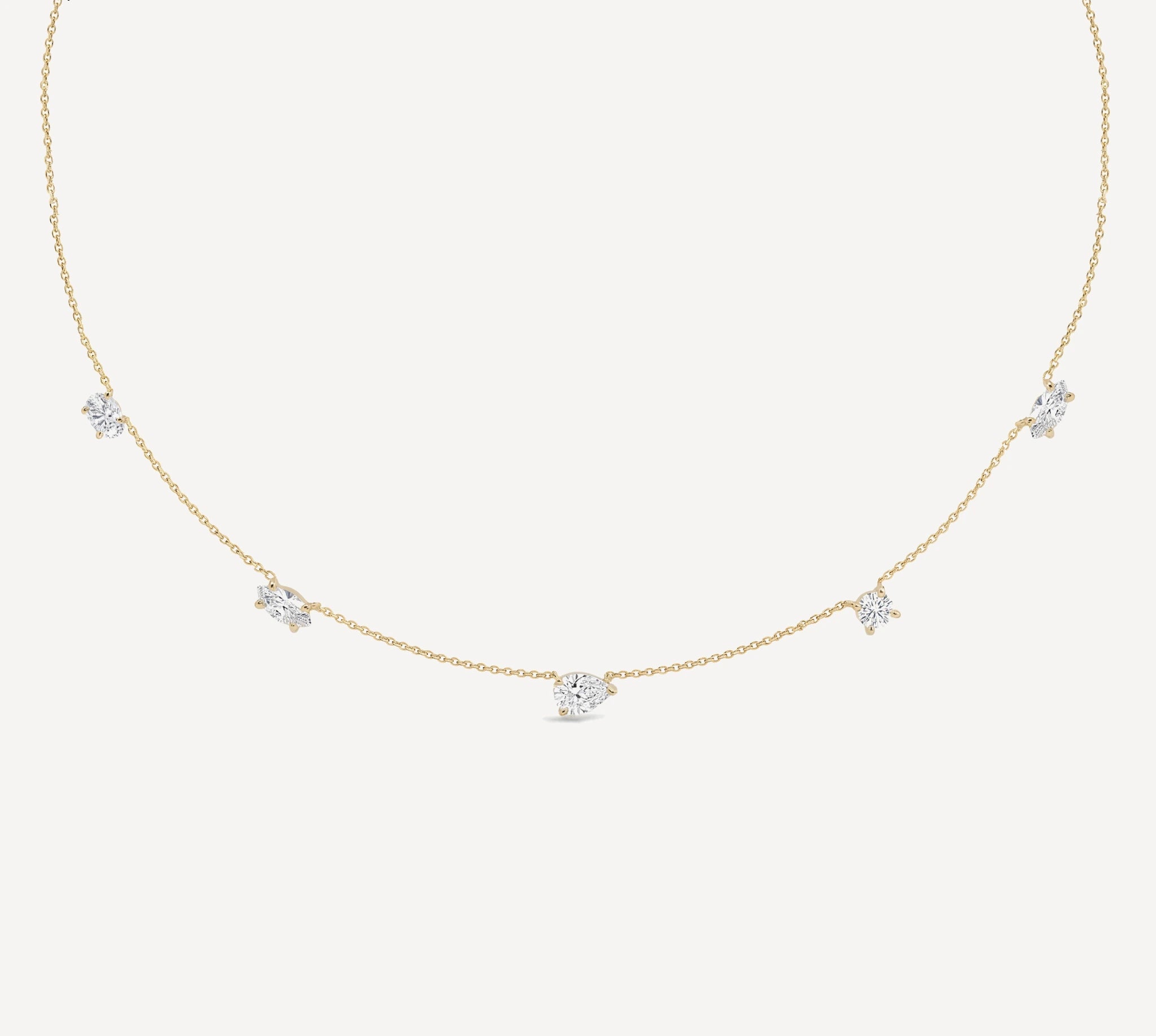 The Nola 1.50ct Diamond Necklace features a refined arrangement of pear-shaped and round brilliant diamonds set on a delicate gold chain for timeless elegance by HLSK Jewellery